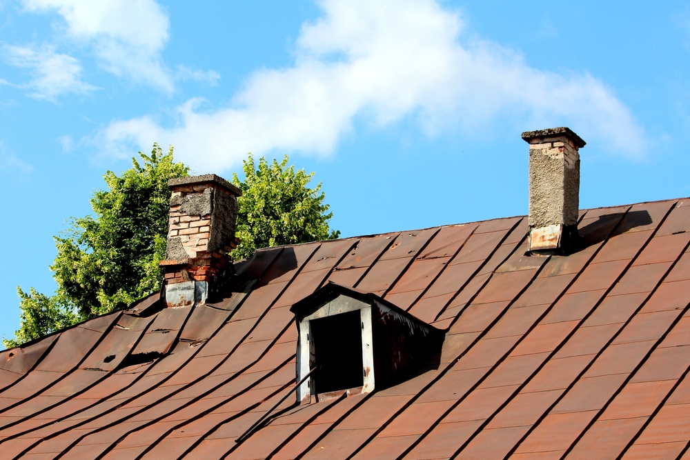 Damaged partially broken old chimney